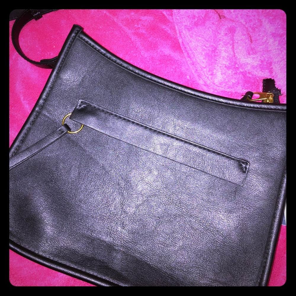 A black over the shoulder leather purse